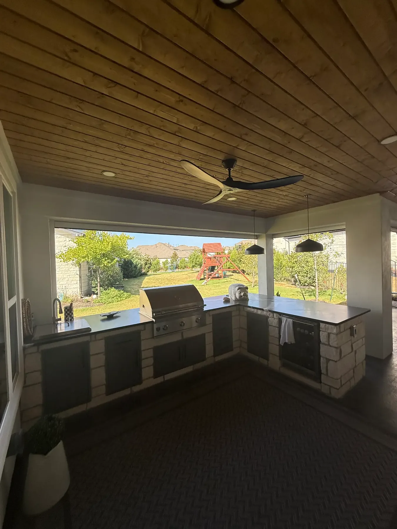 Built-in outdoor kitchen under a covered structure